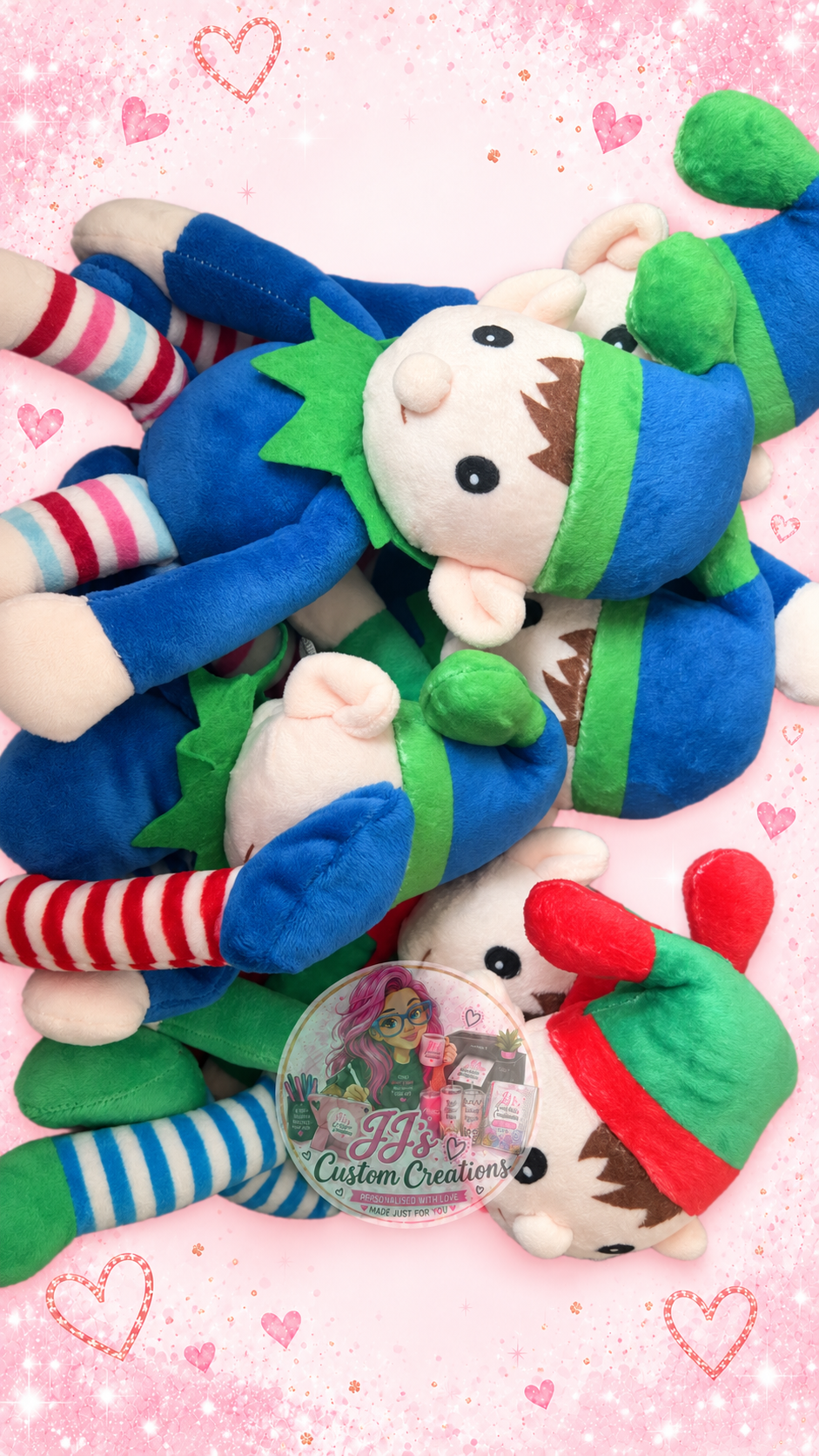 Colourful plush elf options on JJ's pink sparkle background