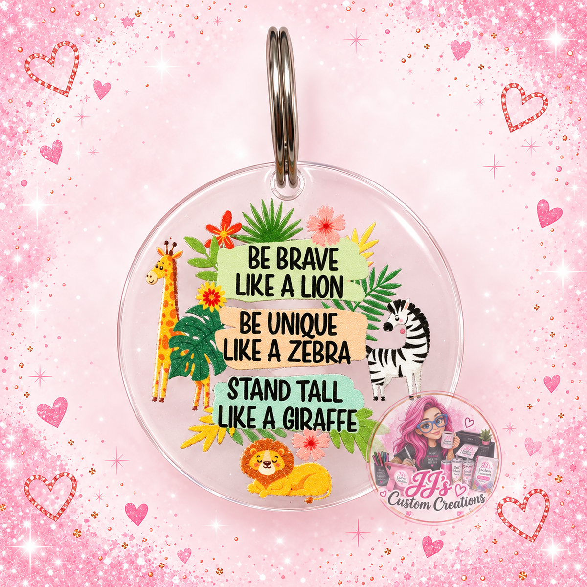 Be Brave acrylic jungle animal keyring on pale pink sparkle background with JJ's watermark