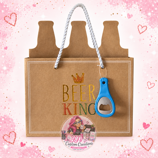 Beer King kraft gift bag with white cord handles and blue bottle opener on pale pink sparkle background with JJ's watermark