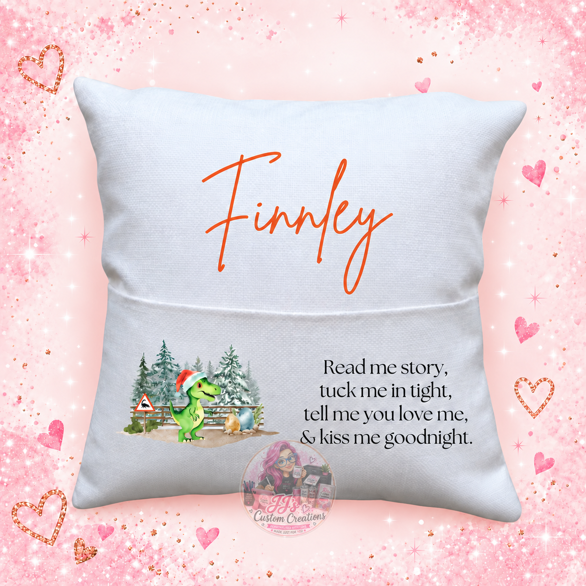 Personalised Finnley dinosaur reading cushion on JJ's pink sparkle background
