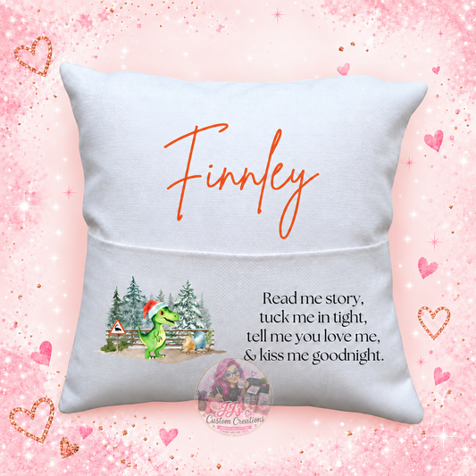 Personalised Finnley dinosaur reading cushion on JJ's pink sparkle background
