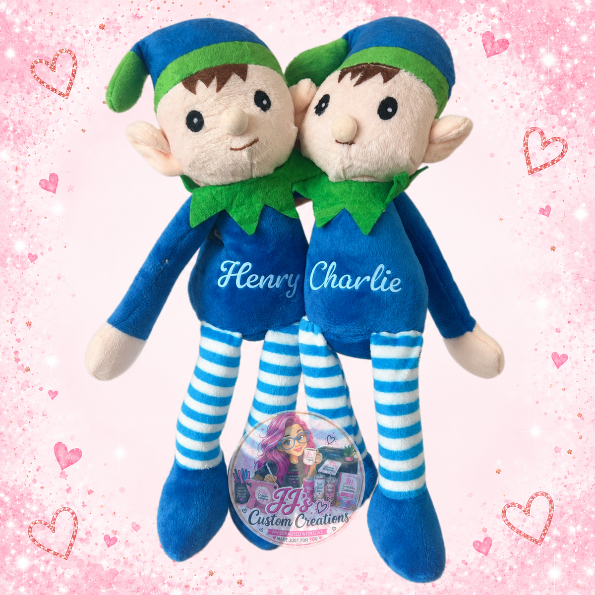 Henry and Charlie personalised plush elves on JJ’s blush pink sparkle background