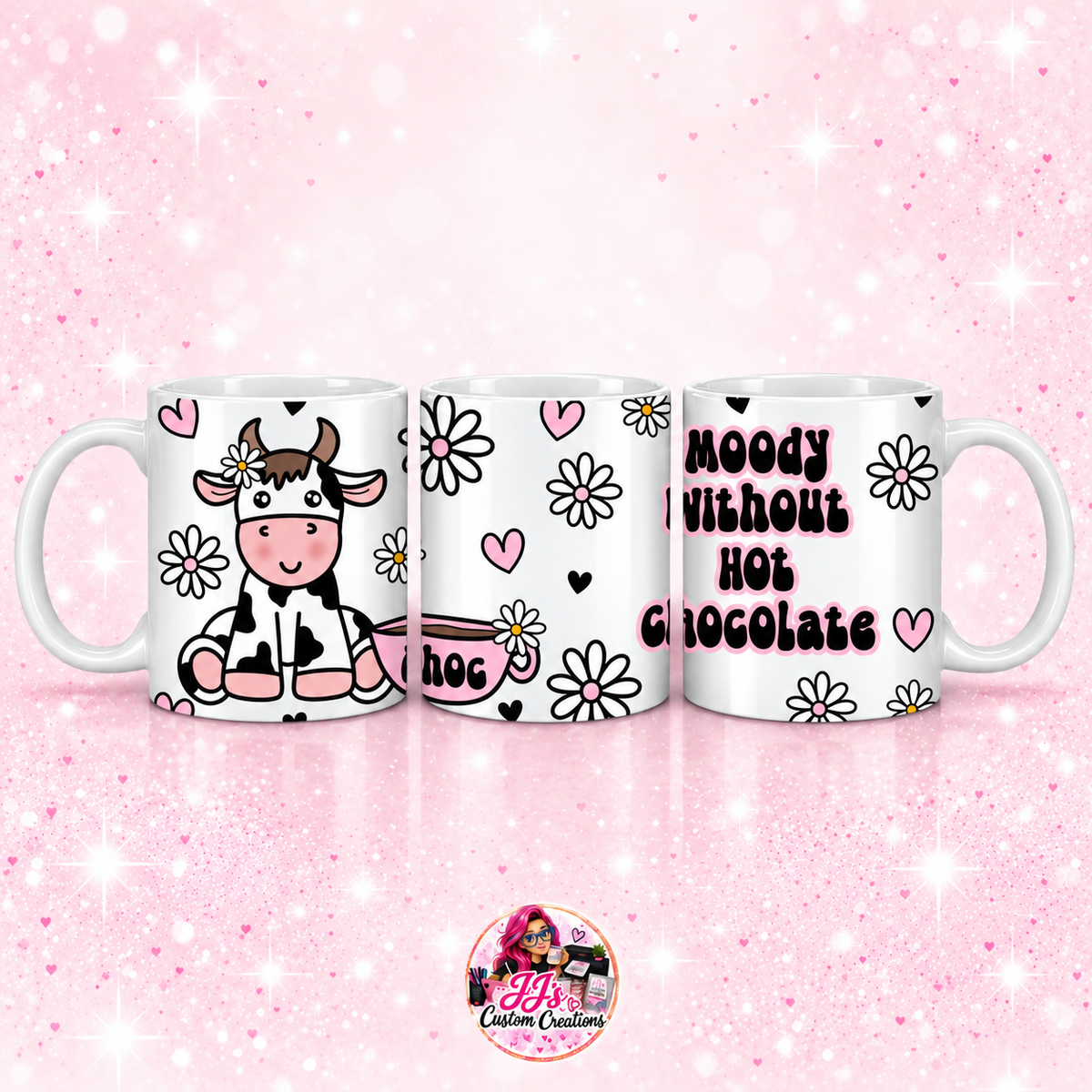Moody Without Hot Chocolate mug on JJ’s pale pink sparkle background with logo watermark