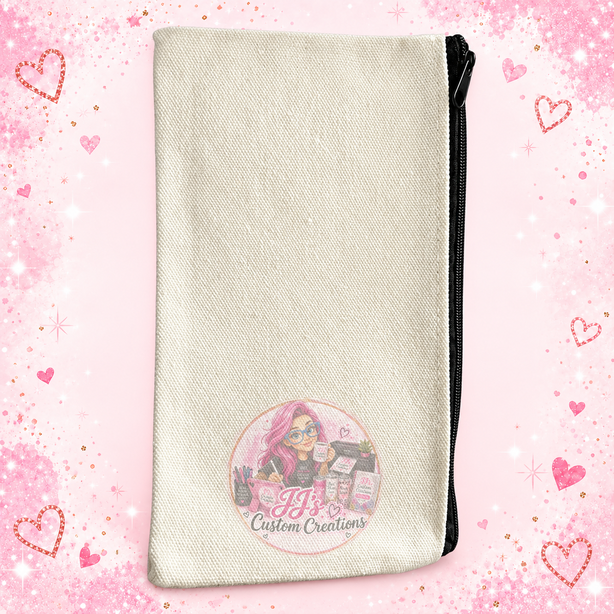 Blank cream canvas pencil case with black zip on pink sparkle background, JJ's logo watermark over image