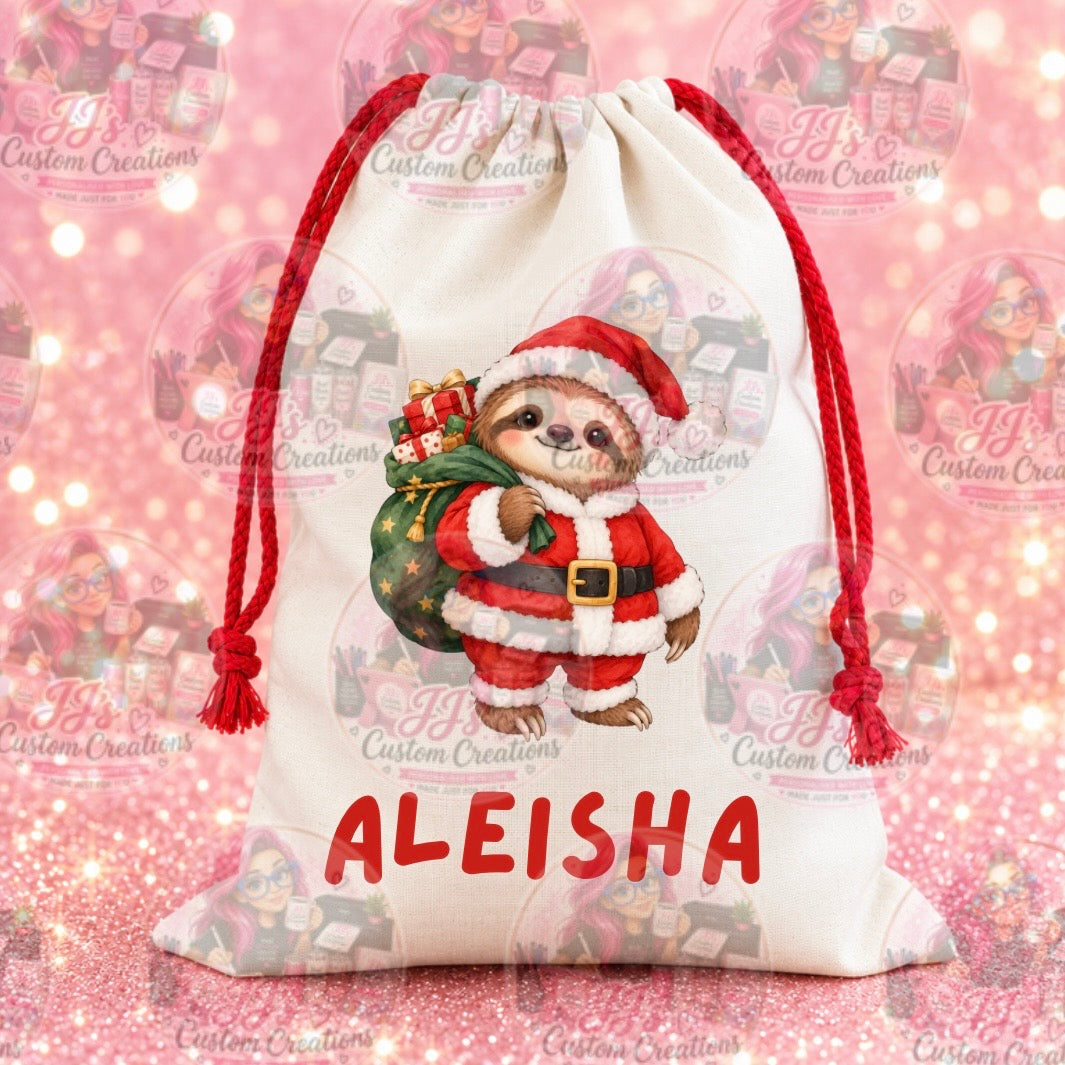 Personalised cream Christmas drawstring sack with a festive sloth design