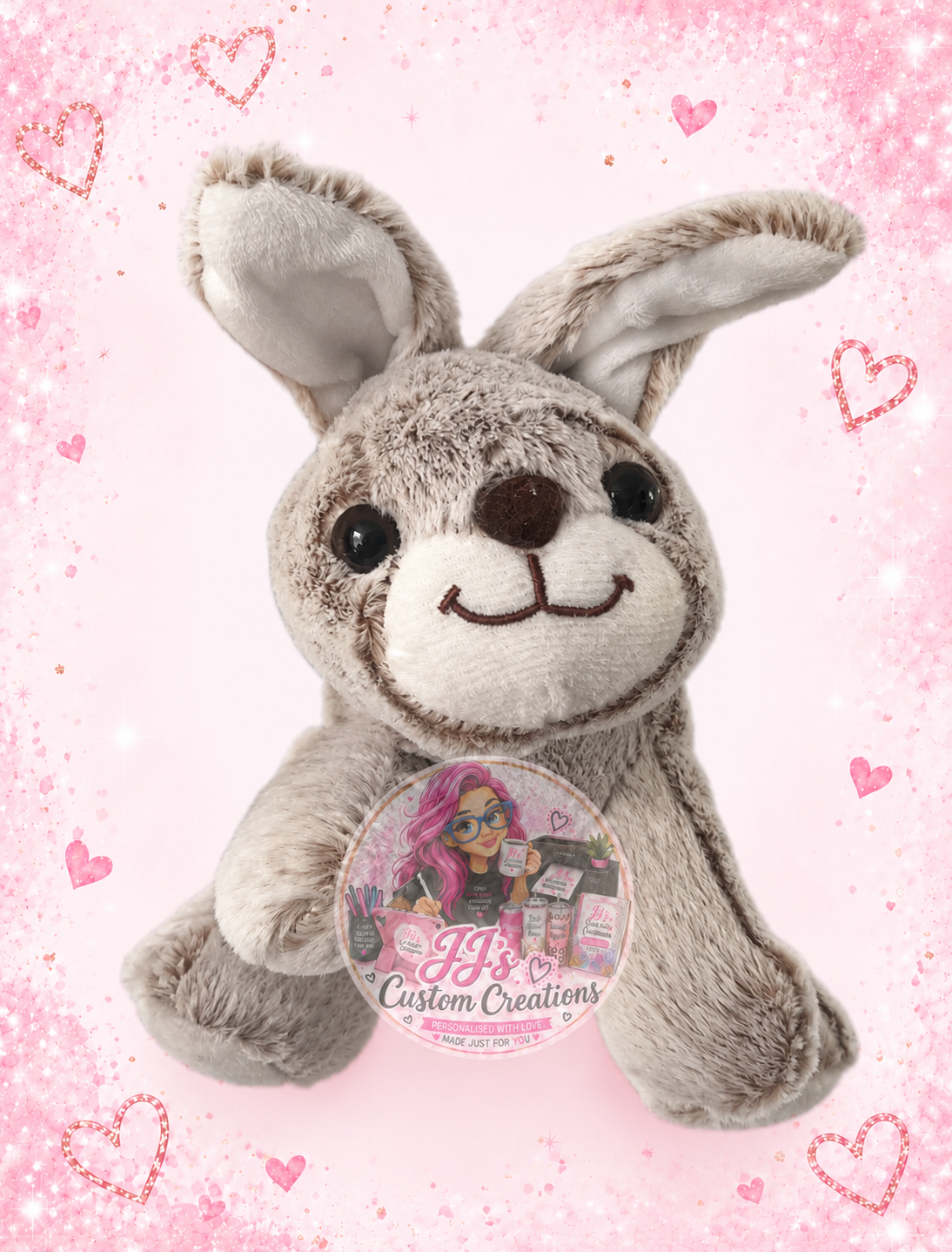 Plain grey bunny teddy with folded ear on JJ's pink sparkle background