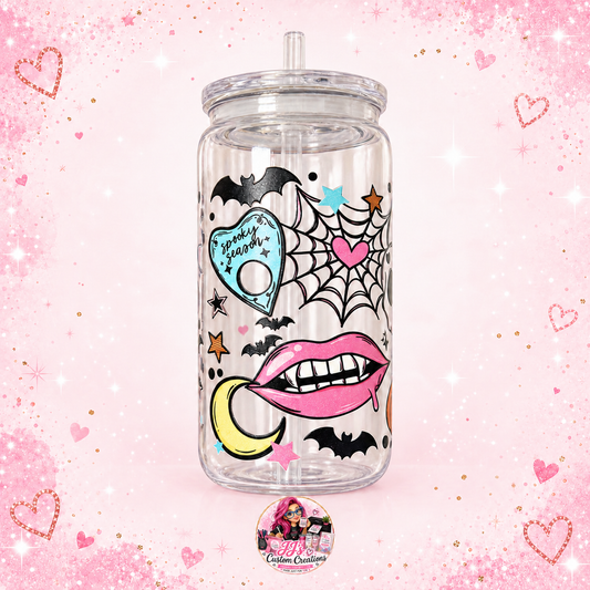 Clear Spooky Season plastic Libbey cup on a full square pale pink sparkle background with JJ's watermark